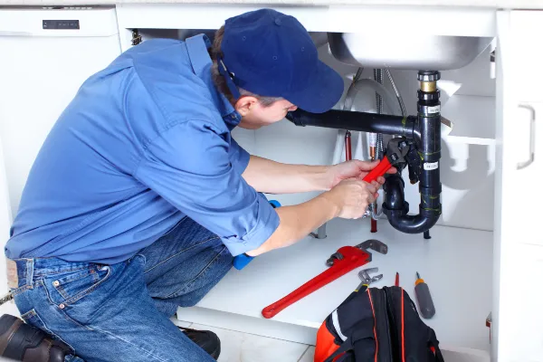 a male plumber fixing a toilet from Emergency Plumber Richardson in Richardson, TX 