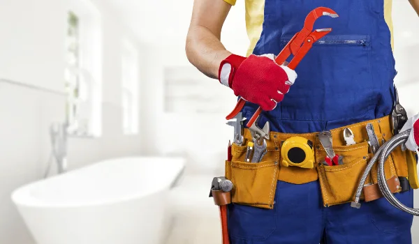 the torso of a plumbing technician showing a tool belt in Richardson, TX - Residential Plumbing Services